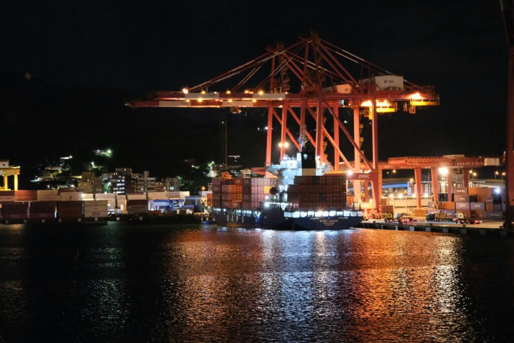 Container ship at night in a Chinese port representing rare earth export restrictions