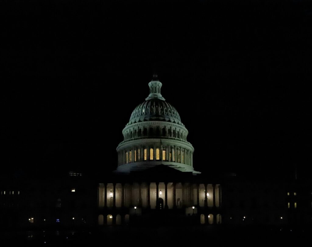 United States Capitol building dome illuminated at night during the 2026 midterm election fundraising crisis