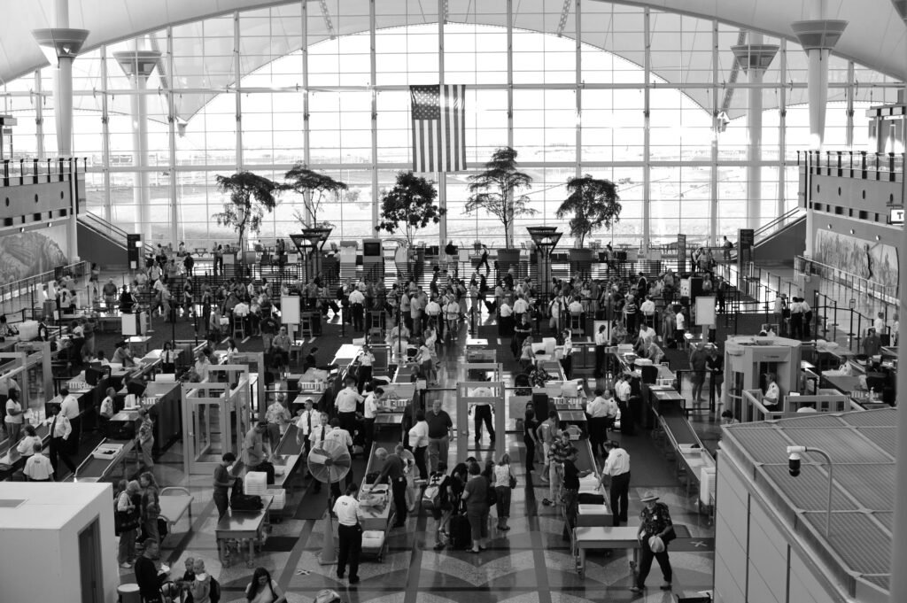 Passengers going through airport security screening in the United States during travel delays