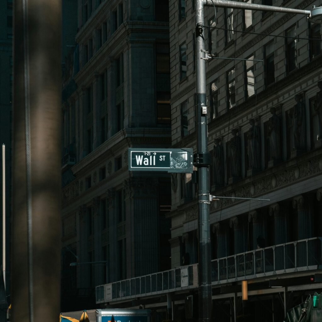 Wall Street sign in New York representing U.S. business and services sector economic activity