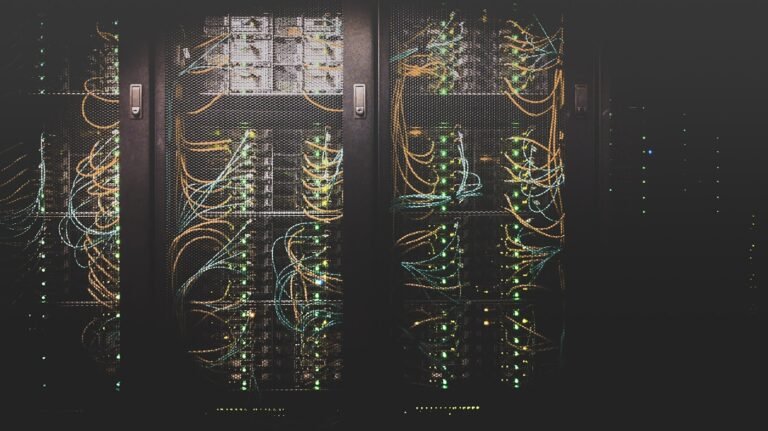 Colossus 1 Memphis NVIDIA H100 H200 GB200 server racks blue lit Anthropic compute deal