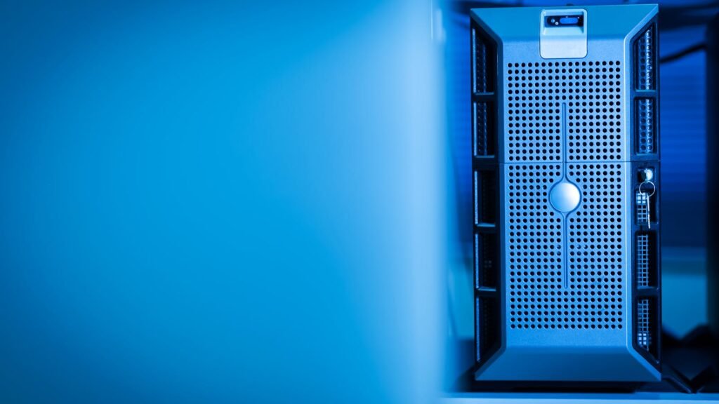 A server unit glowing in a blue-lit data center, illustrating Dell's surging AI server business