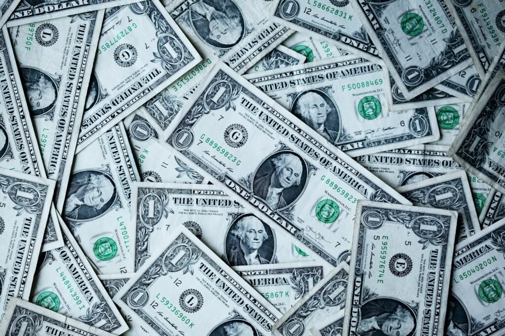 Cisco Alibaba earnings - dollar bills representing M&A activity