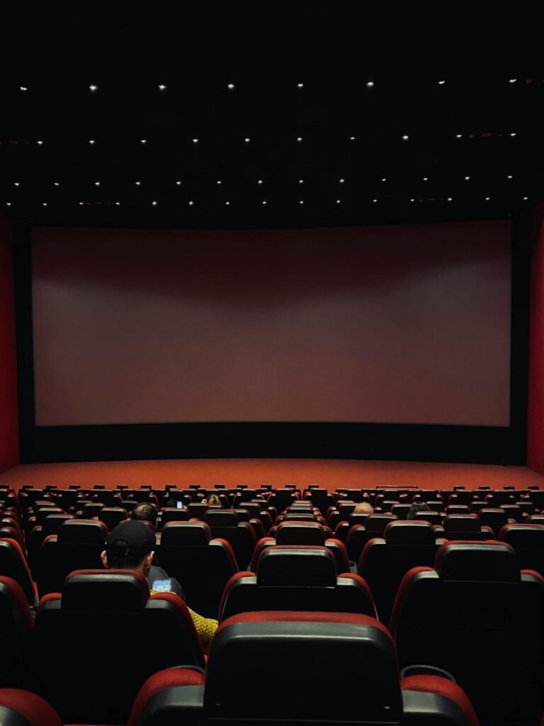 Empty cinema theater with red seats representing Michael Jackson biopic Antoine Fuqua 600 million box office