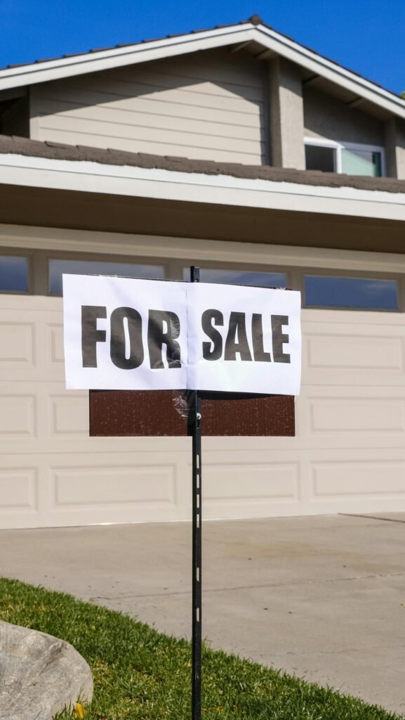 Modern American suburban house with For Sale sign representing mortgage rates 5 week high May 2026 housing market
