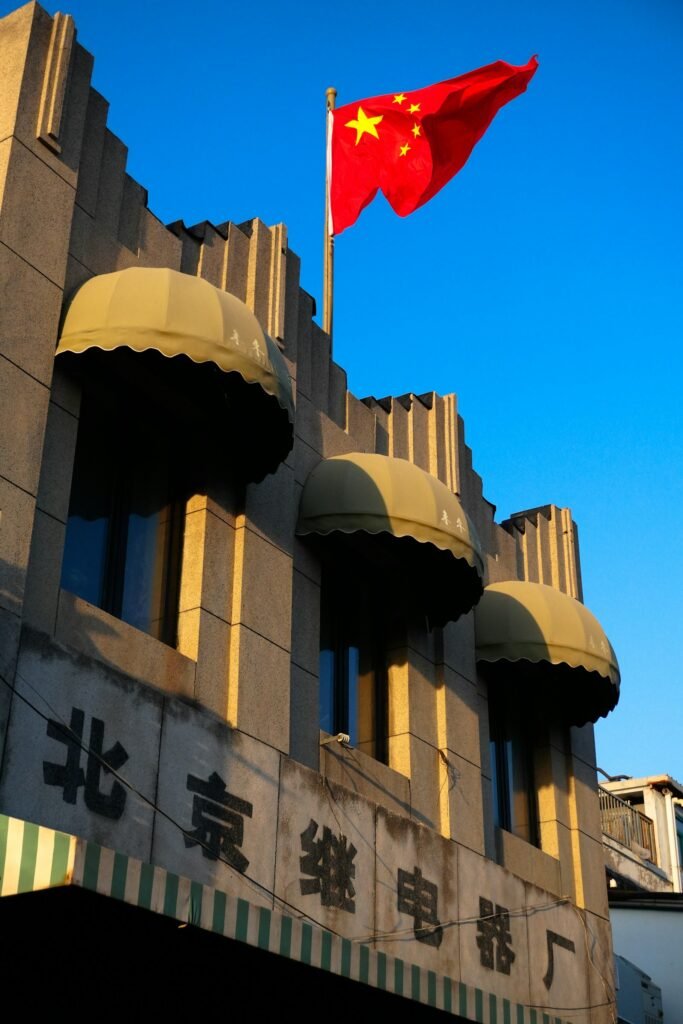 Trump Beijing visit 2026 - Chinese flag on government building