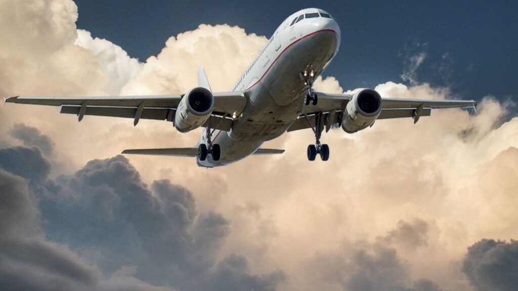 A large government jet against a cloudy sky, illustrating the new Air Force One