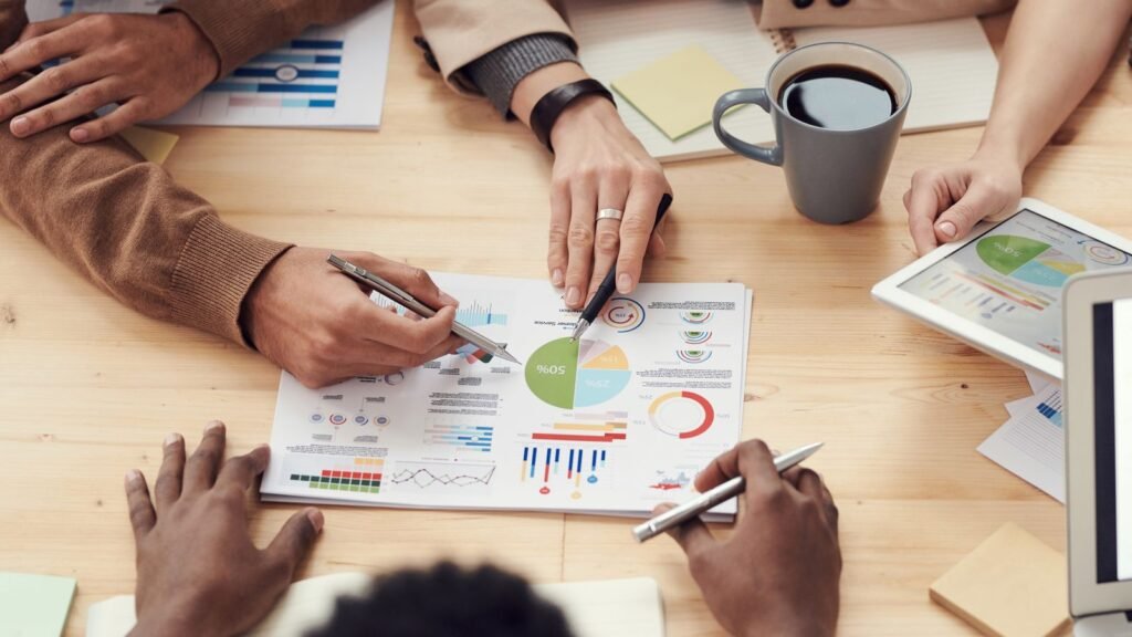 A startup team working around a table, illustrating the mid-June venture funding surge